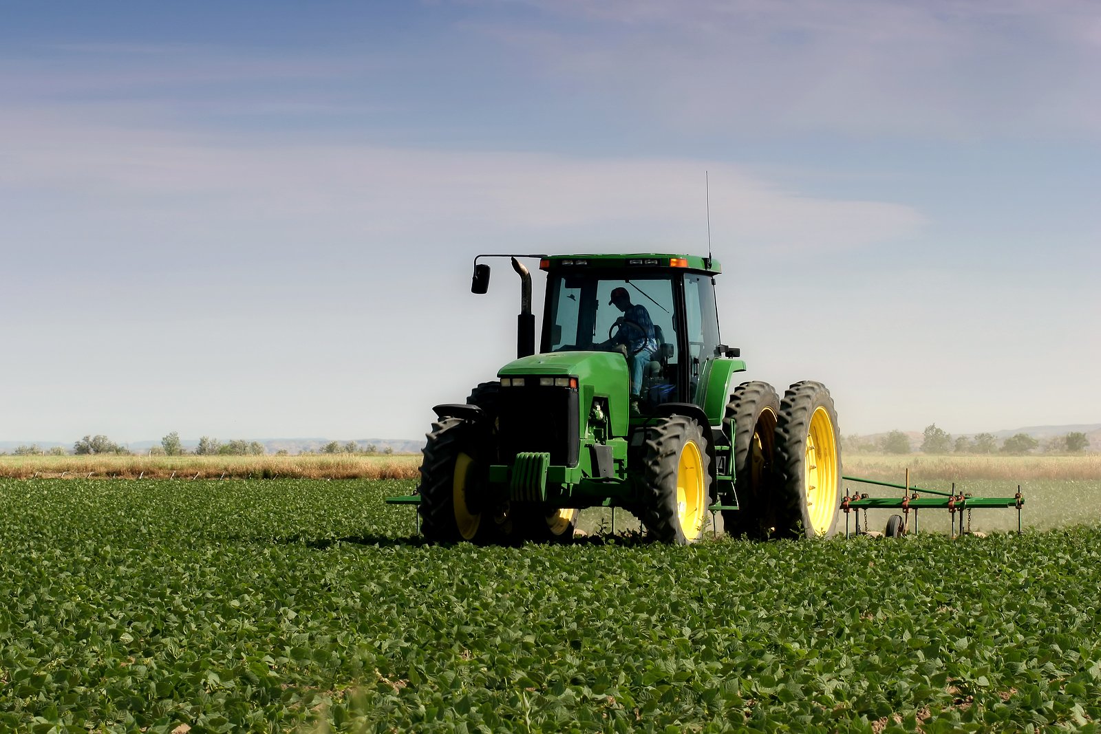 bigstock-Farmer-Plowing-The-Field-128993
