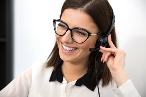 cheerful-female-support-operator-in-headset-SBI-300854753